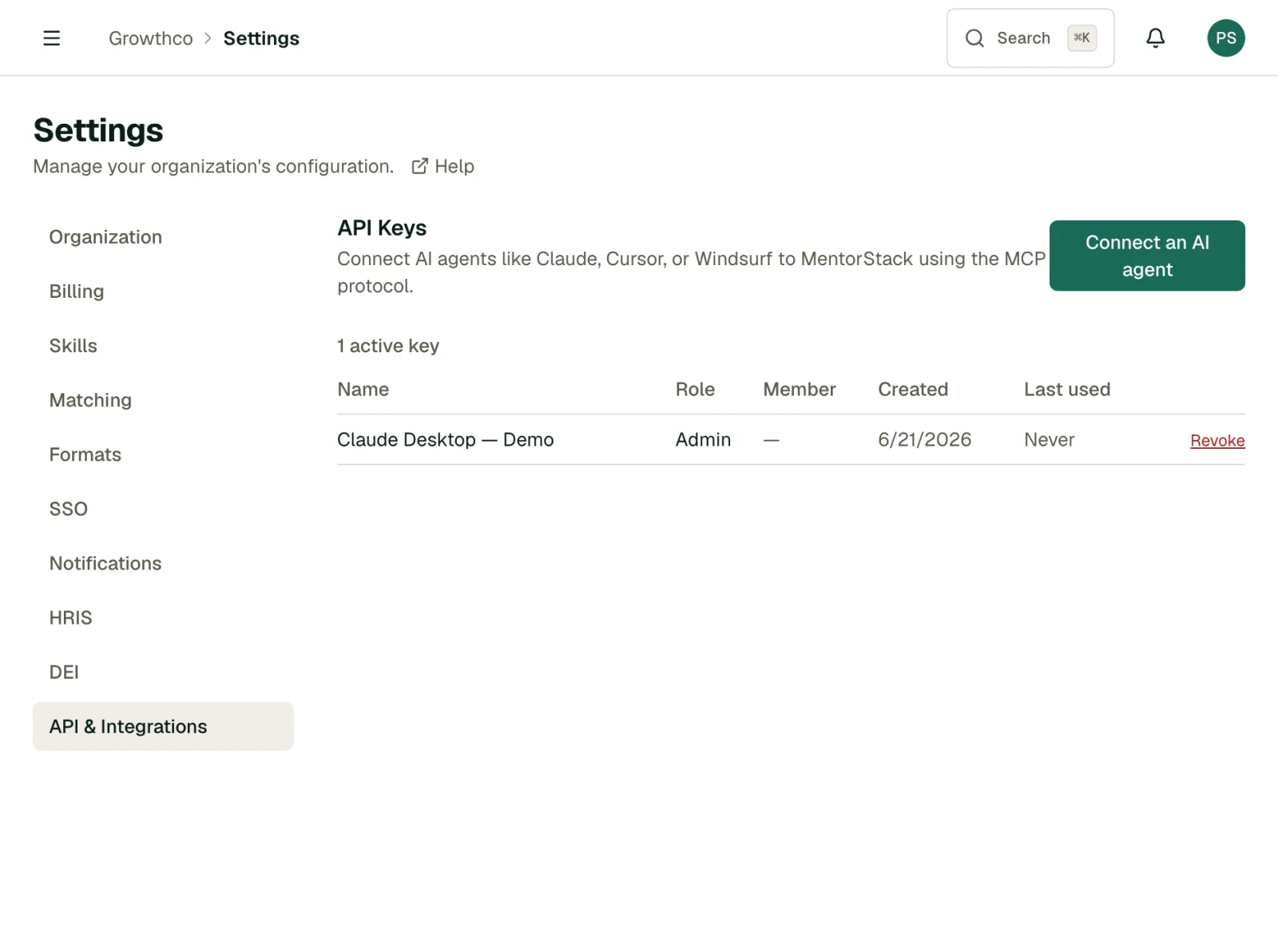 API keys table showing name, role, member, created and last-used dates, with a Revoke action